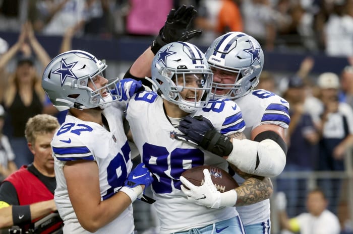 Dallas Cowboys tight end Peyton Hendershot (89) celebrates with teammates after catching a touchdown pass during the fourth quarter against the Detroit Lions at AT&T Stadium.